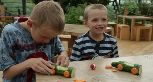 Children making vegetable lego